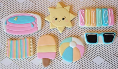 Cookies in unusual shapes decorated in bright-colored frosting