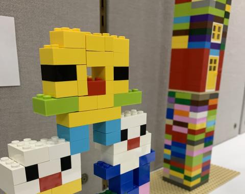 Two simple towers made with plastic bricks.